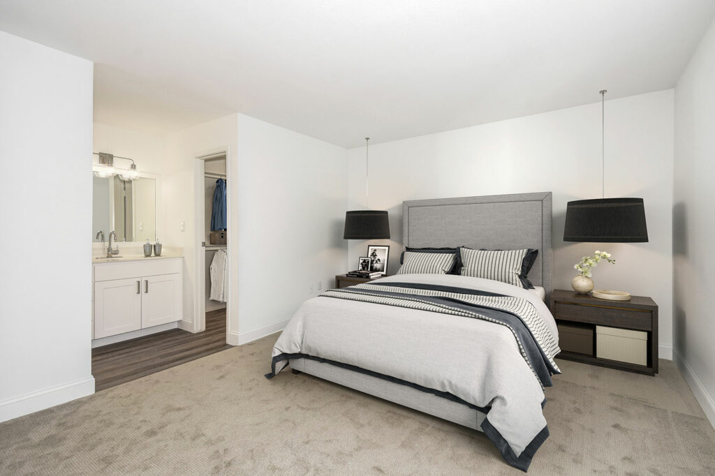 A Spark Furnished Housing bedroom with a bed, dresser, and mirror. | Spark Living